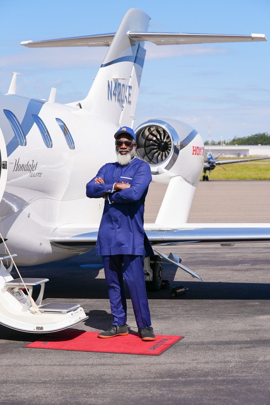 Myron Golden standing in front of a private jet